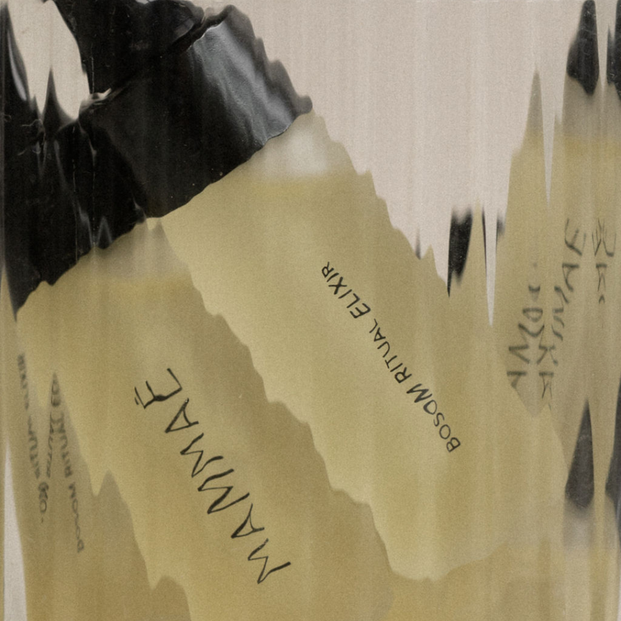 Torn paper with text partially obscured by black tape promoting a limited edition Bosom Ritual Elixir Deluxe Sample 5ml from Mammae The Embodied Mother.