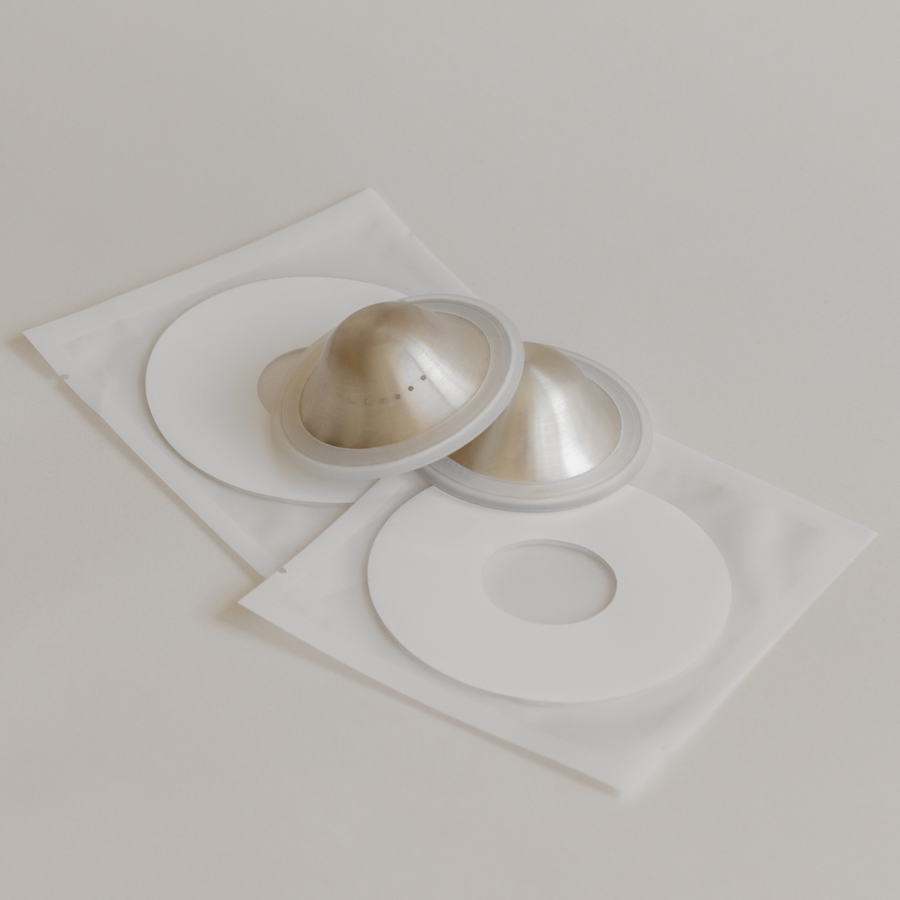 Mammae Silver Nipple Care bundle laid flat on a neutral backdrop. 