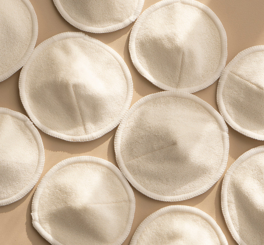 A group of Bosom Wearables contoured organic breast / nursing  pads for postpartum mothers by Mammae The Embodied Mother.