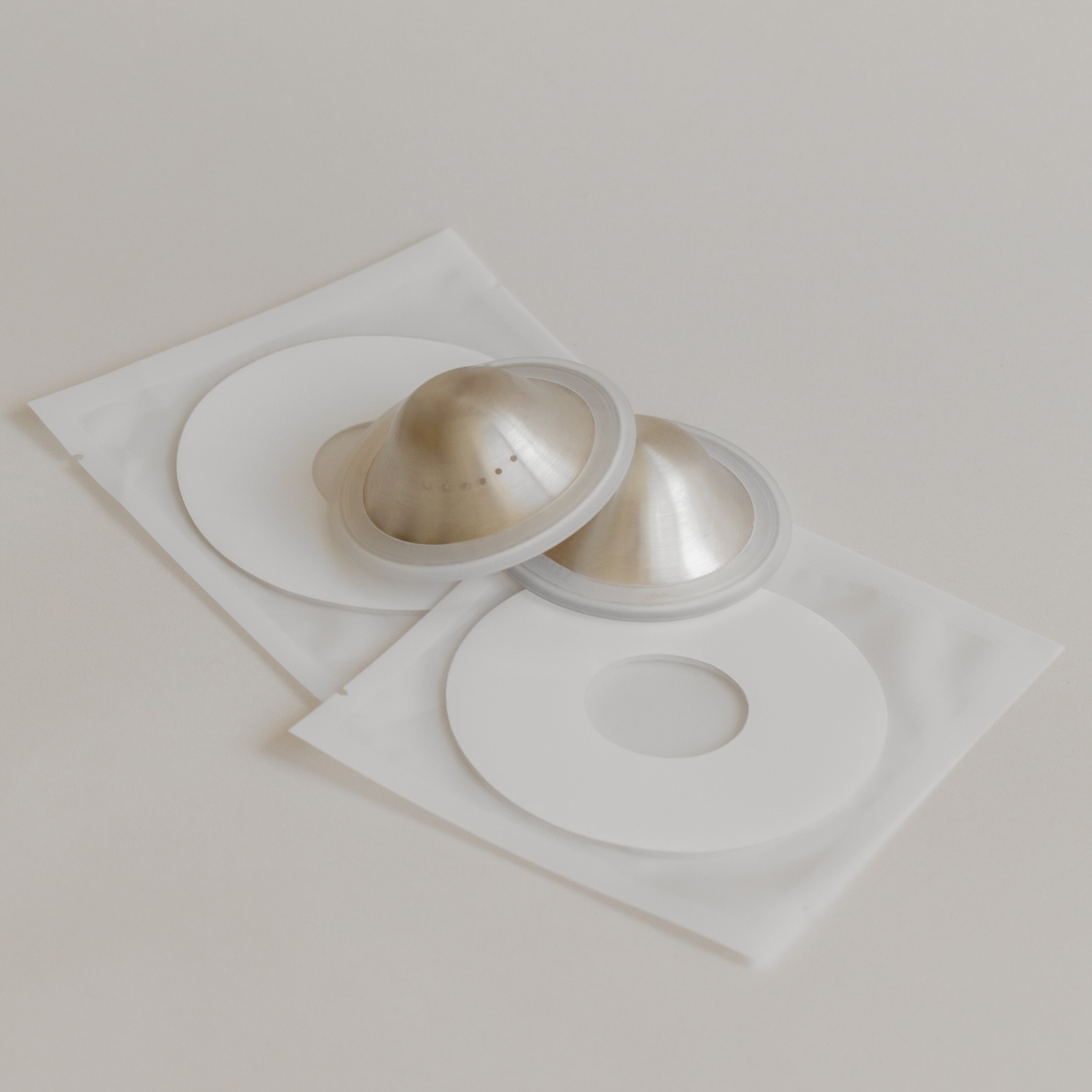 Mammae Silver Nipple Care bundle laid flat on a neutral backdrop. 